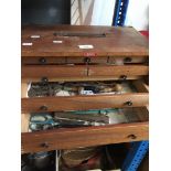 A 5 drawer cabinet containing small tools