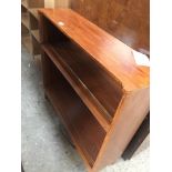 A stained wood open bookcase