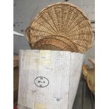 A box containing wicker/straw baskets
