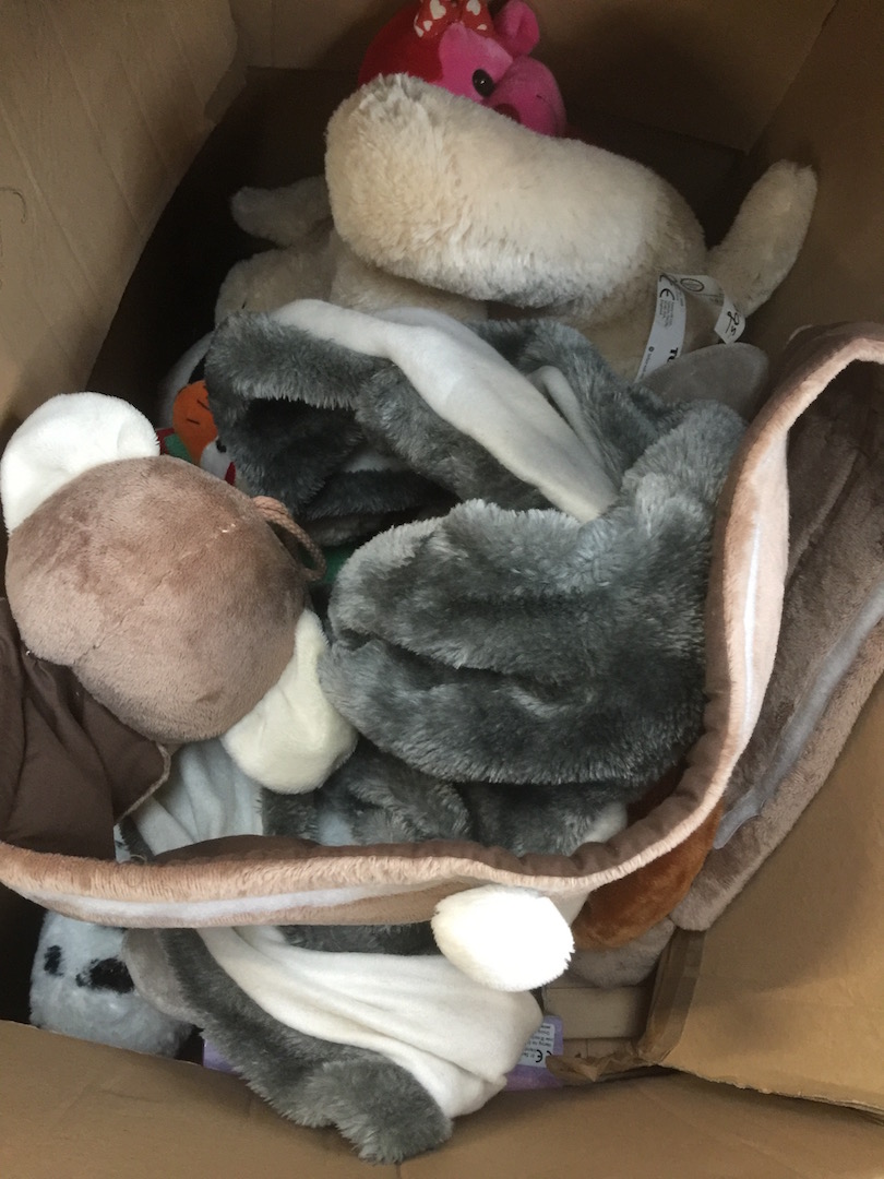 A large box of soft toys