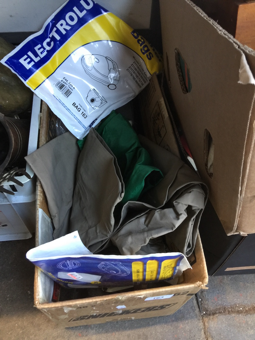 A box of misc vac parts and bags