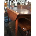 A drop leaf kitchen table