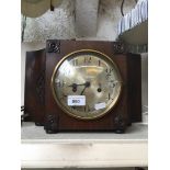 An oak mantle clock.