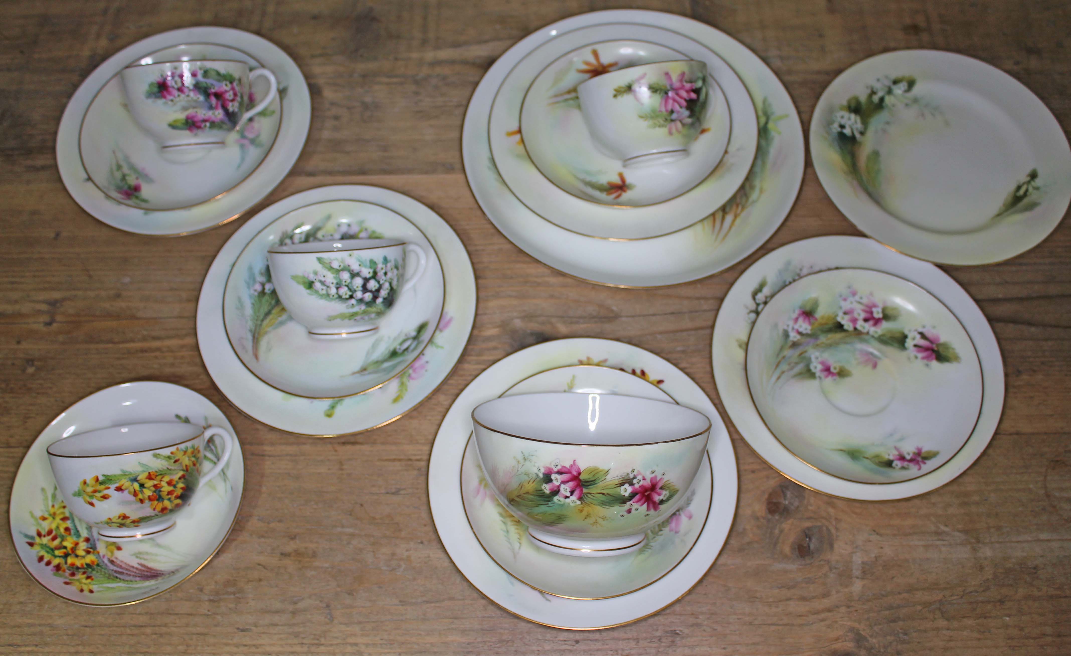 A Royal Worcester botanical 18 piece part tea service comprising three cups, saucers and two