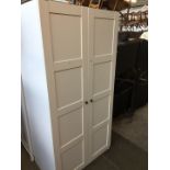 A modern white Ikea wardrobe