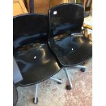 Two plastic office swivel chairs