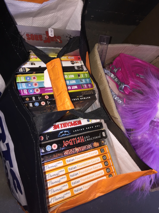 A box of mainly DVDs