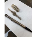 Two silver brooches, Edinburgh 1938, and Birmingham 1875/99, and a sterling propelling pencil