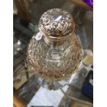 Silver topped scent bottle