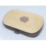 A Victorian ivory purse, length 7.5cm.