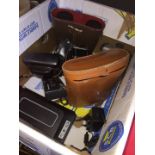 A box of cameras to include Polaroid, Olympus, etc, 2 pairs of binoculars in cases and a radio