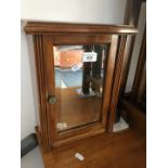 A small mirrored cabinet