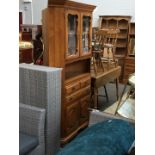 A large walnut corner display cabinet