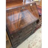 A reproduction mahogany bureau