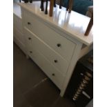 A modern white chest of drawers