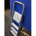 A pair of small aluminium stepladders