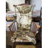 A spindle back sprung rocking chair