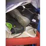 A bag of various working boots