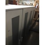 A pair of white Ikea wardrobes