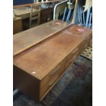 A mid century teak dressing table