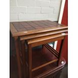 A Danish tiled top teak nest of tables