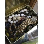 Tin of costume beads etc.