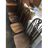 A set of 4 spindle back elm seated chairs