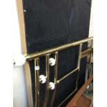 A brass effect double head board