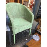 A green lloyd loom type chair
