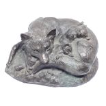 A bronze style figure depicting a fox and cubs, length 14.5cm.