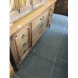 A reproduction walnut sideboard