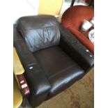 A brown leather tub chair