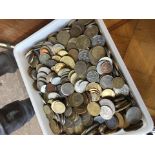 A tub of old foreign coins