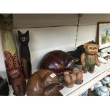 A quantity of mainly wooden ornamental animals, cats, bears and a stoneware dog.