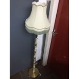 An onyx and brass effect standard lamp