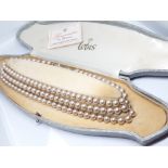 A cased set of Lotus pearls.