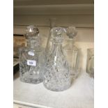 4 glass decanters and 1 vase