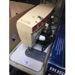 A Singer Stylist 367 electric sewing machine with pedal