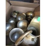 A box of brassware