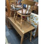 A drop leaf table and 5 spindle back chairs