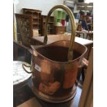 A brass and copper coal scuttle