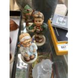 4 Hummel Goebel figurines to include a pressed glass example