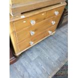 A Victorian stripped and waxed pine chest of drawers