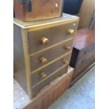 An oak small chest of drawers