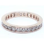 A silver eternity ring, marked '925 DQCZ', size U, with box.