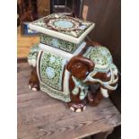 An elephant seat/plant stand
