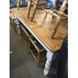A pine country kitchen table with painted legs