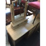 A modern light wood effect dressing table