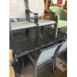A large aluminium patio table with set of 6 chairs