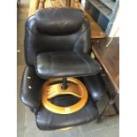 A black leather swivel armchair and stool